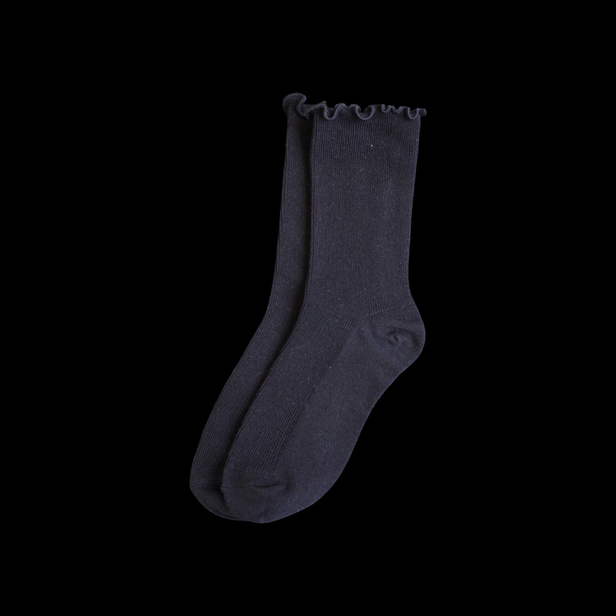 SUNMOOL black curly ruffle socks with a loose-fit ruffle cuff.