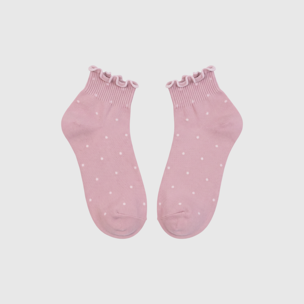 SUNMOOL baby pink ankle socks with white polka dots and ruffled lettuce-edge cuffs in a soft cotton blend.