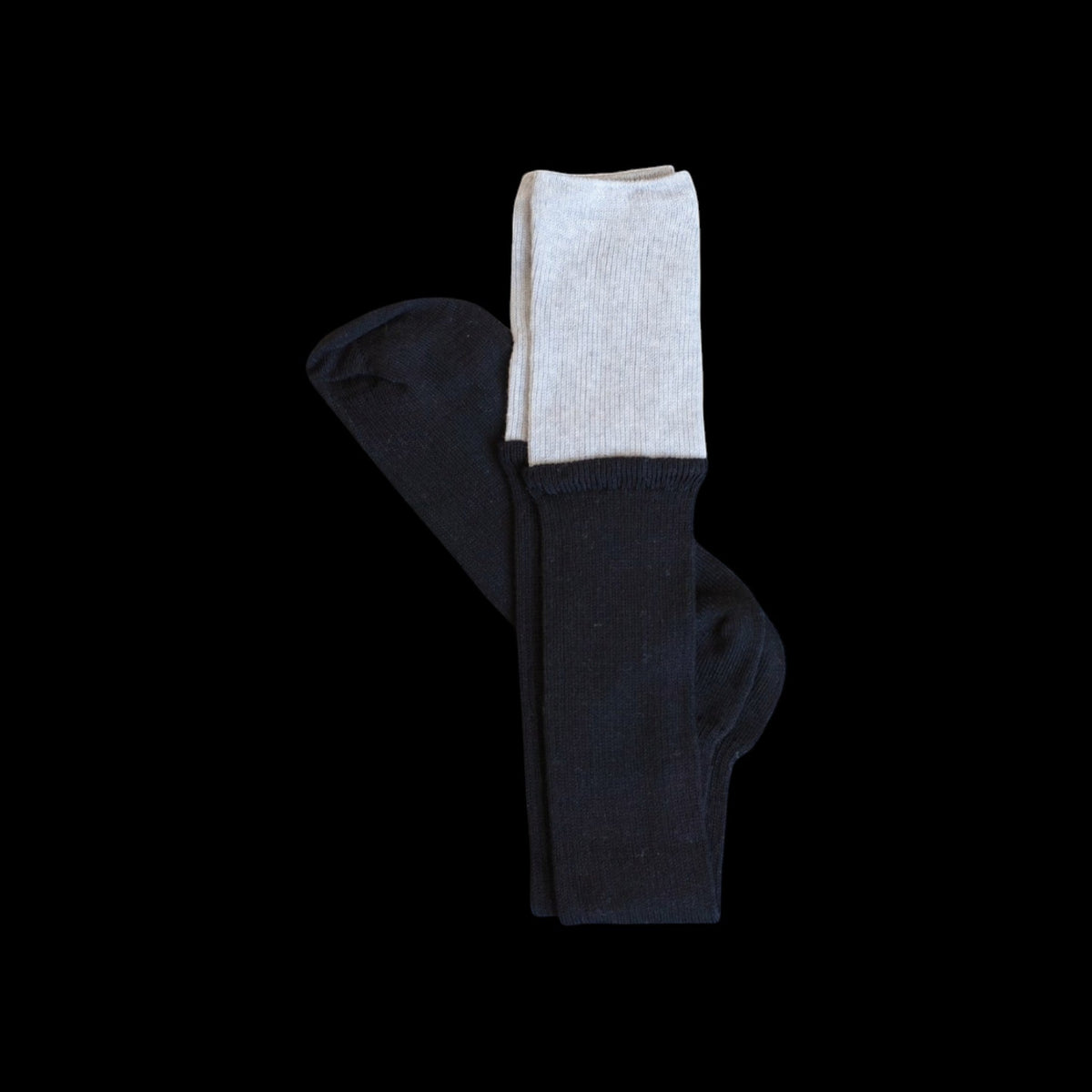 SUNMOOL black knee-high socks with a contrasting light grey dip-dyed ribbed cuff on a black background.