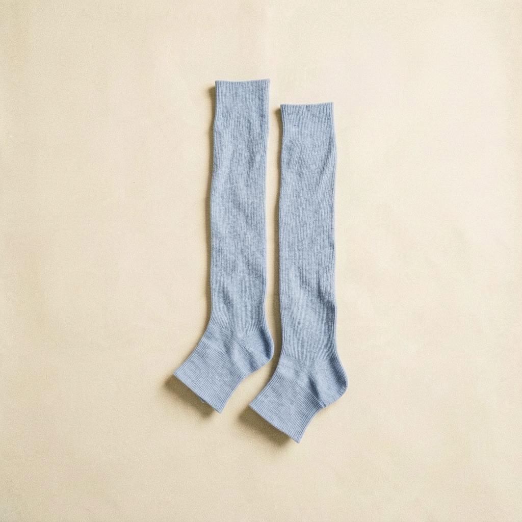 SUNMOOL open-toe knee-high socks in light blue with a ribbed texture, perfect for styling with sandals or mules.