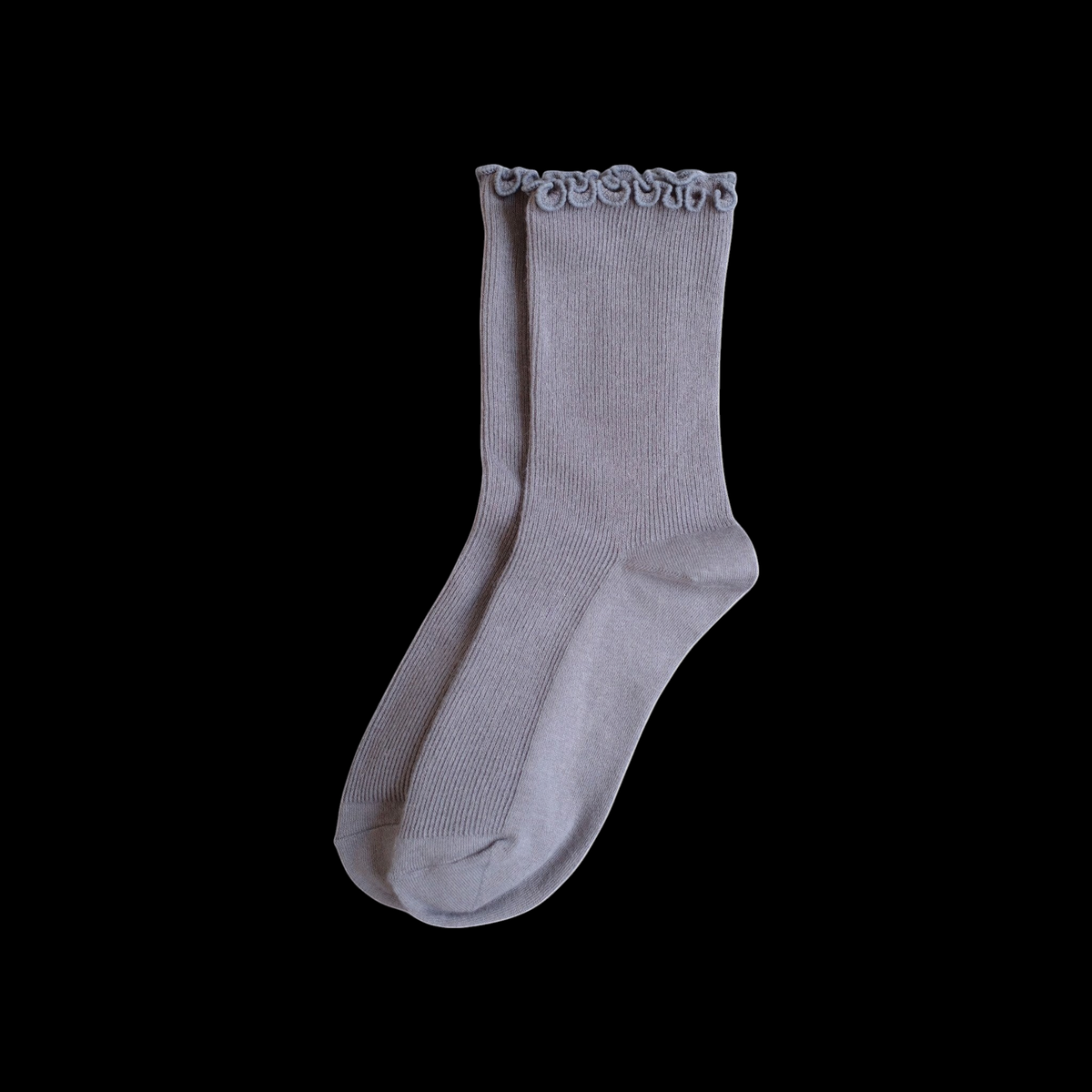 SUNMOOL grey ribbed socks with a playful curly ruffle cuff, designed for a relaxed, no-squeeze fit.