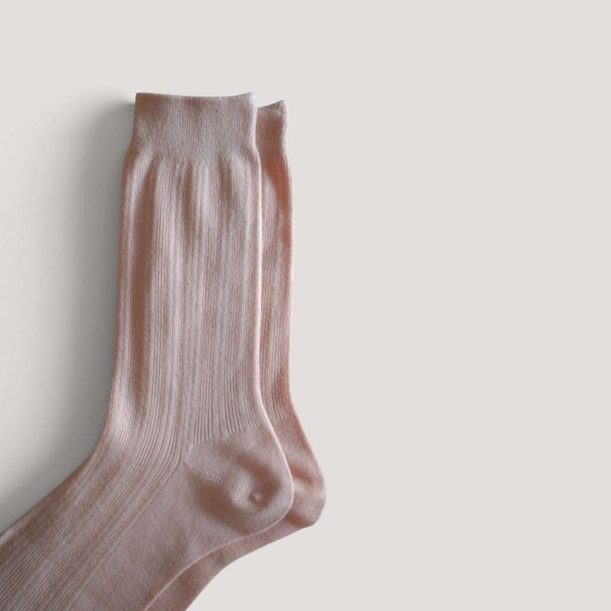 SUNMOOL Pastel Cloud socks in a soft lavender shade featuring a ribbed knit texture on a neutral background.