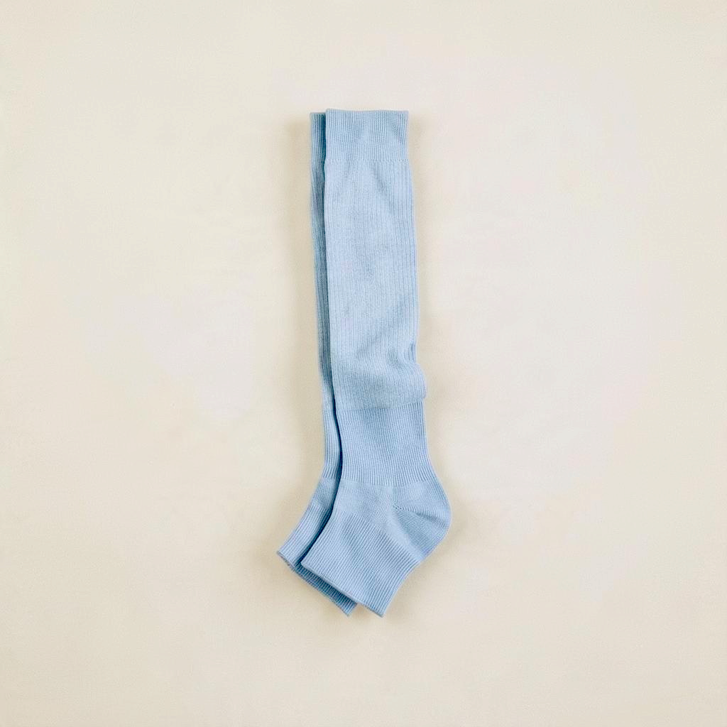 SUNMOOL light blue ribbed open-toe knee-high socks for ballet-inspired styling with sandals or loafers.