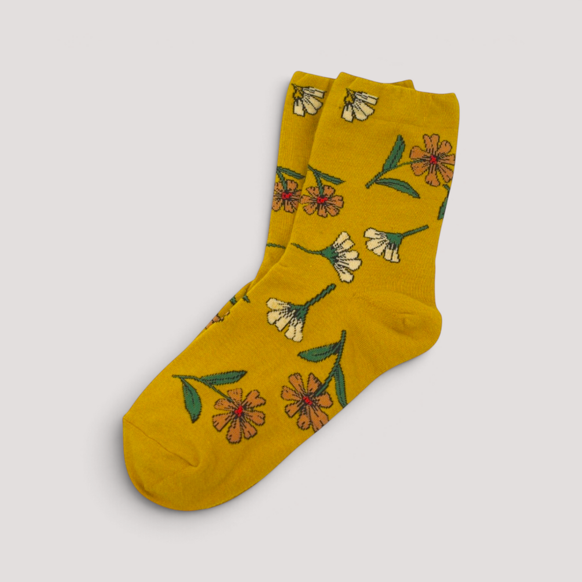 SUNMOOL mustard yellow crew socks featuring a vibrant botanical wild flower pattern and comfortable elastic fit.