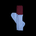 SUNMOOL sky blue knee-high socks with a contrasting deep red dip-dyed ribbed cuff on a black background