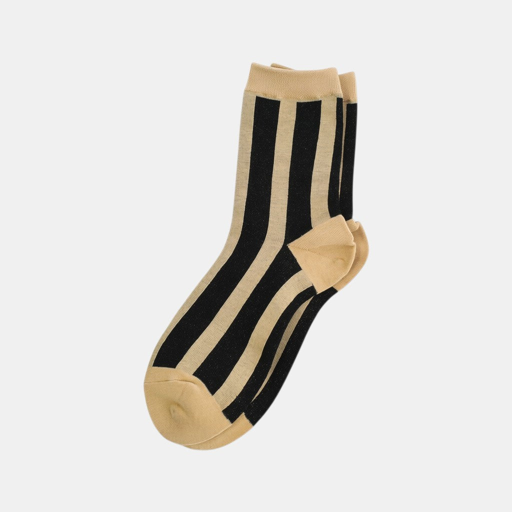 SUNMOOL ivory and black vertical striped socks with subtle glitter tinsel threading for a shimmering finish.