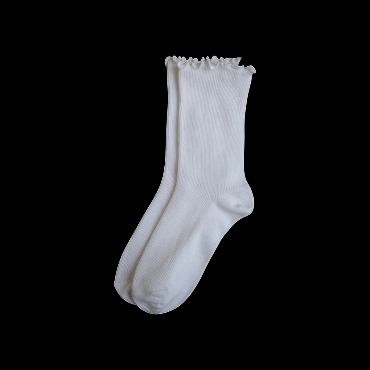 SUNMOOL white crew socks featuring a playful curly ruffle cuff and a comfortable loose-fit design.
